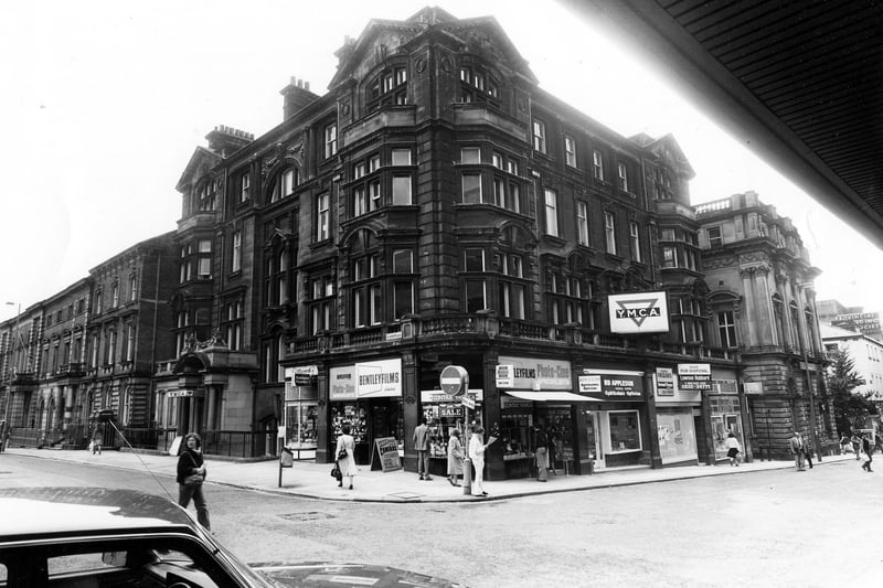 The junction of Albion Street and Albion Place, showing the YMCA building in the centre in June 1984. Shops on the ground floor of the building are Eastwood tobacconists, Bentley films photographic equipment, Raymond Appleson, opticians, a vacant shop and Hunting Lambert travel agents. On the left of the picture is the former County Court building and on the right the Britannia Building Society.