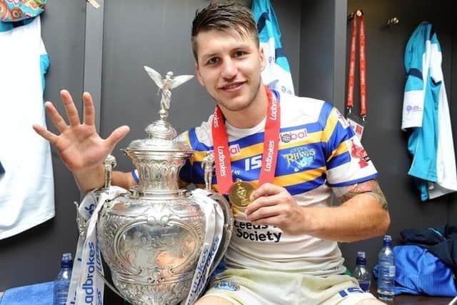 Tom Briscoe seen with the Challenge Cup in the Wembley changing room after his five-try feat for Leeds Rhinos 11 years ago. Picture by Steve Riding.