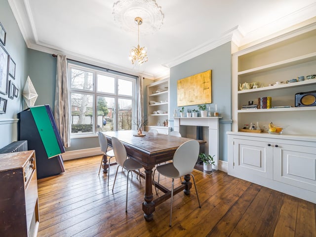 The dining room is a rear-facing reception room which is laid out as a formal dining room. Like the living room there are impressive proportions as well as ceilings, but neighbours on the street have previously opened the dining room up to the kitchen.
