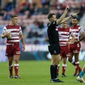Rhinos' Zane Tetevano is shown a red card by referee Liam Moore. Picture by Ed Sykes/SWpix.com.