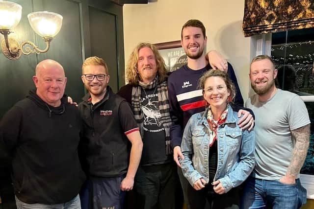 Ian Webb (centre, tall), with wife Megan Webb (jean jacket) at the pub after their game was postponed on October 24 in Wakefield. Picture: Megan Webb / SWNS
