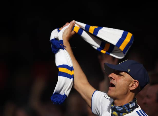 LEEDS, ENGLAND - AUGUST 06:  A Leeds United fans waves a scarf during the Premier League match between Leeds United and Wolverhampton Wanderers at Elland Road on August 6, 2022 in Leeds, United Kingdom. (Photo by Marc Atkins/Getty Images)