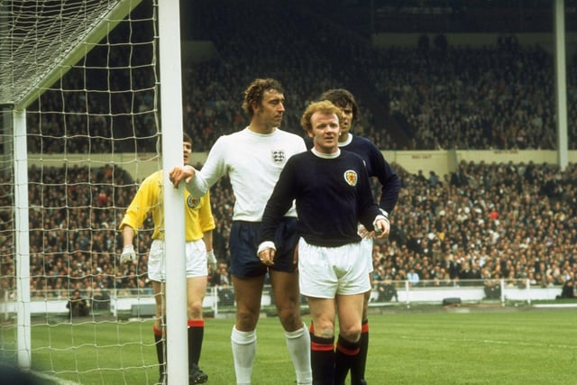 Billy Bremner (front) and Francis Munro of Scotland wait for a cross with Martin Chivers of England during a match at Wembley Stadium in London. England won the match 3-1. (Credit: Allsport UK /Allsport)
