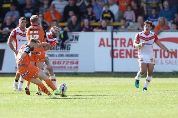 Tigers' Danny Richardson kicks a golden-point drop goal to beat Catalans Dragons at the Jungle in June. Picture by John Clifton/SWpix.com.