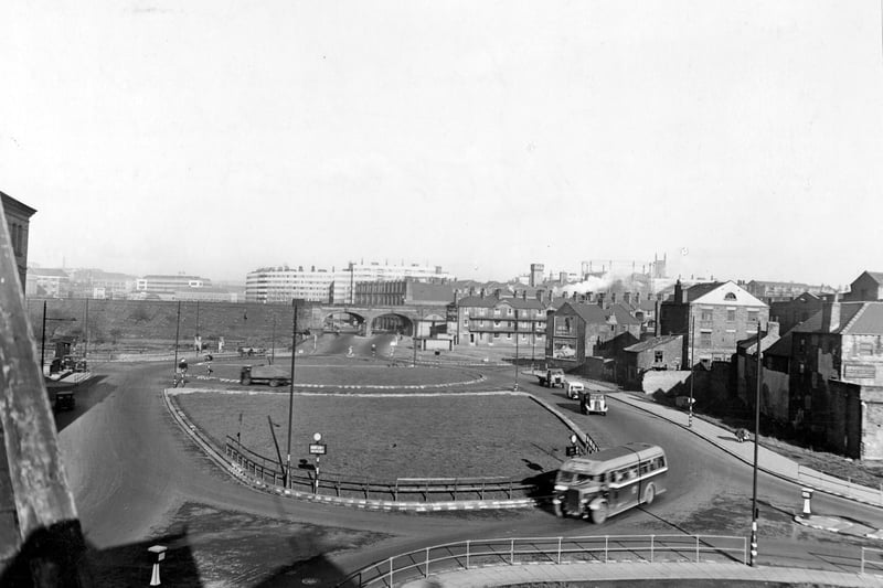 East Street roundabout looking North in November 1945. An elevated view showing traffic using the roundabout. In the distance are Quarry Hill Flats.