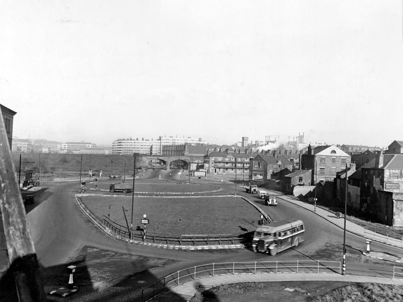 East Street roundabout looking North in November 1945. An elevated view showing traffic using the roundabout. In the distance are Quarry Hill Flats.
