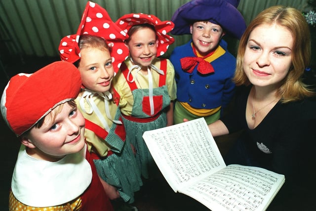 Pictured, right, is Kelly Gomersall who was choreographing The Wizard Of Oz which was being staged at Queensway Primary School in December 1998. She is pictured with some of the Munchkins, from left, Jack Aynsley, Lauren Gresty, Rachel Greenwood and Jonathan Barrett.