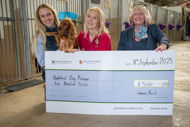 B&DWYW - SGB-52351 - Jan from Barratt and David Wilson presenting Pontefract Dog Rescue with their cheque