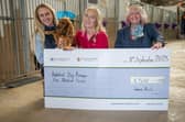 B&DWYW - SGB-52351 - Jan from Barratt and David Wilson presenting Pontefract Dog Rescue with their cheque