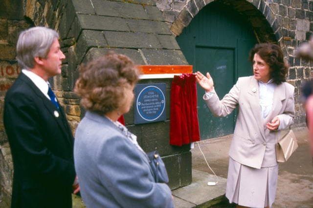 The unveiling of a plaque commemorating Colonel John Thomas North (1842-1896) in recognition of his gift of Kirkstall Abbey to the City of Leeds. It reads 'Colonel J.T. North 1842-1896 purchased the Abbey and grounds in 1888 and gave them to the city.' In blue letters around the circumference it states 'This plaque was erected by the Yorkshire Society'. Pictured in August 1990.