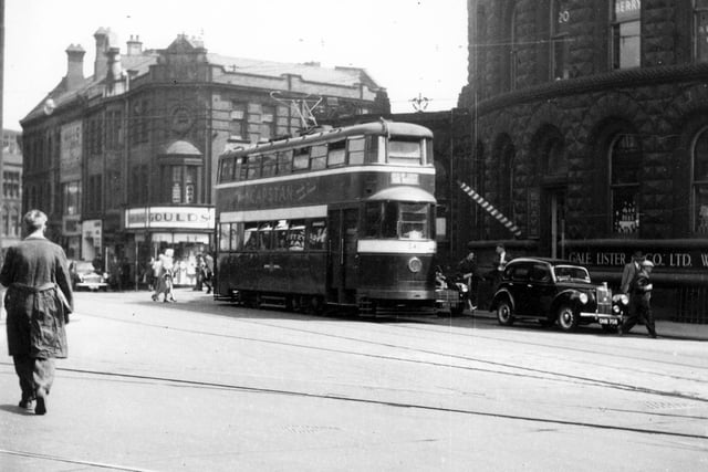 Tram 543 travelling route 16 to New Inn, Wortley. Corn Exchange and junction can be seen in the distance. Pictured in July 1954.