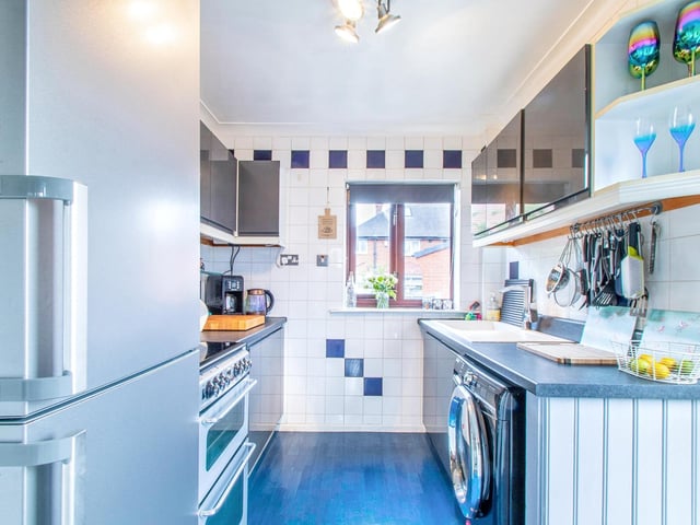 There is also a fully fitted kitchen with modern appliances.