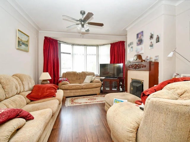 The living room provides ample space for family gatherings and relaxation.