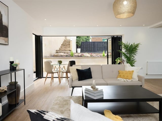 Finished to the highest of standards, luxury laminate flooring flows out underfoot whilst bifolding doors with internal blinds, run the full length of the living-dining area, open to the garden, bringing the outdoors in and inviting alfresco dining throughout the summer months.
