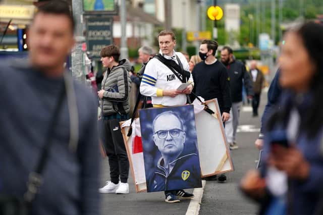 A vendor is seen selling art work of Marcelo Bielsa, Manager of Leeds United. (Photo by Jon Super - Pool/Getty Images)