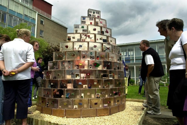 The Secret Garden sculpture was unveiled in the grounds of the East Leeds Family Learning Centre, Seacroft, Leeds on June 18, 2001. Picture shows some of the guests looking at the sculpture after the unveiling ceremony.