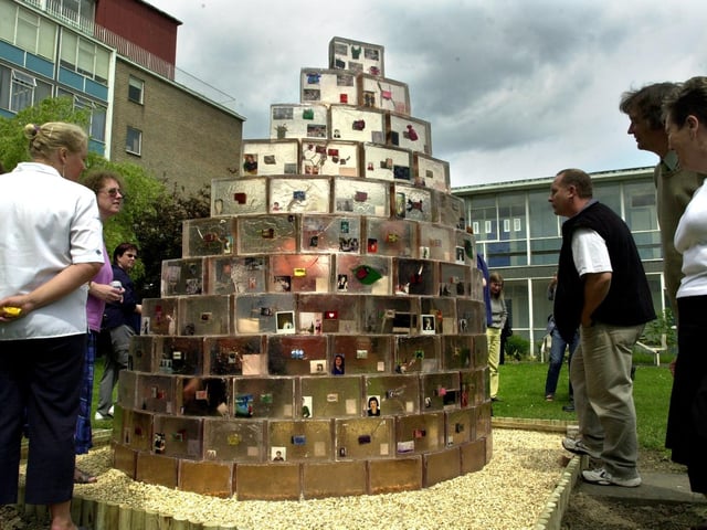 The Secret Garden sculpture was unveiled in the grounds of the East Leeds Family Learning Centre, Seacroft, Leeds on June 18, 2001. Picture shows some of the guests looking at the sculpture after the unveiling ceremony.
