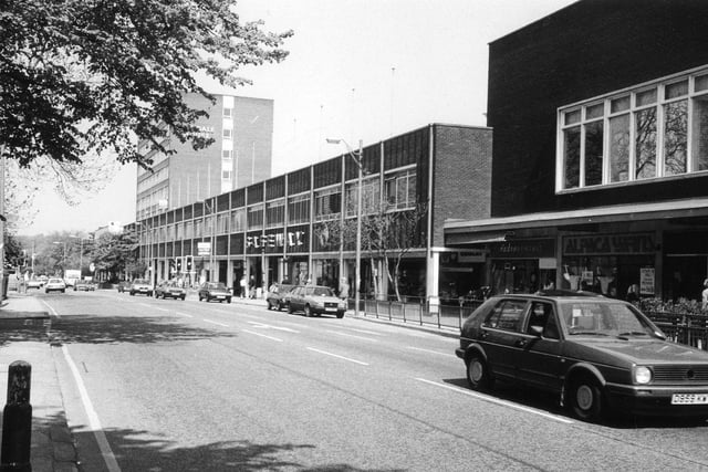 Otley Road in Headingley showing the Arndale Centre running along the right hand side of the road. Shops featured in the photo include Safeway supermarket in the centre and Radio Rentals and Alpaca Yarns towards the right.