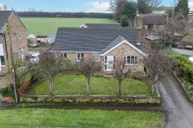 An overview of the front of the six-bedroom bungalow with front garden.