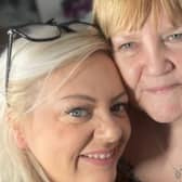 Kate Challinor, left, with one of her clients who has been given a cover-up tattoo as part of the charity initiative with The Inkredible Foundation.