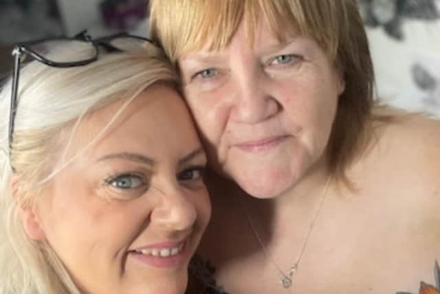 Kate Challinor, left, with one of her clients who has been given a cover-up tattoo as part of the charity initiative with The Inkredible Foundation.