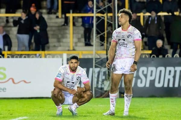 Rhinos' Nene McDonald and Derrell Olpherts dejected after their side's loss at Castleford. Picture by Allan McKenzie/SWpix.com.