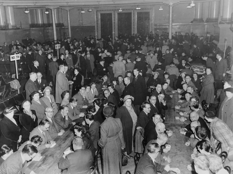 Rows and rows of tables and a large body of counters at Leeds Town Hall totalling the votes cast in the city constituencies in the General Election in October 1951.