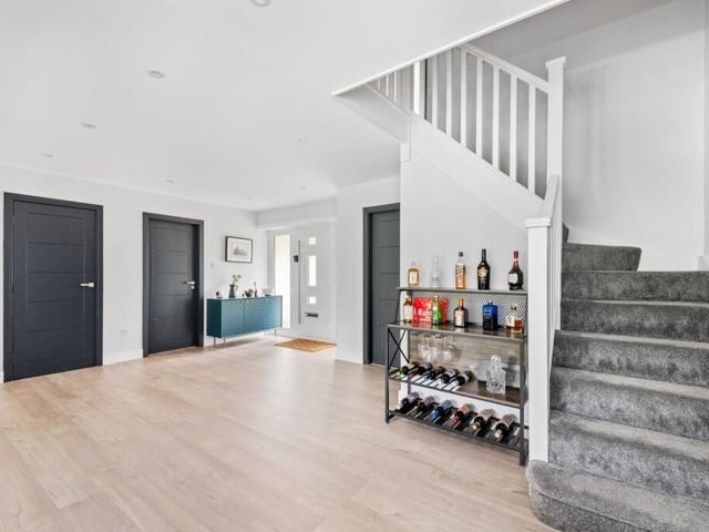 The hallway and reception space with staircase up.