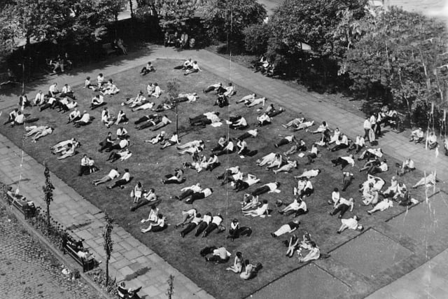City centre office workers taking in the sun during their lunch break in June 1981. The photo was taken from the tower of St John's Church.