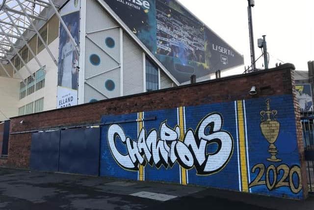 The mural, painted opposite Elland Road's Centenary Pavillion, was created by Adam Duffield and former Leeds United midfielder Mateusz Klich. It celebrates Leeds' promotion to the Premier League in 2020, when they won the league and were crowned champions.