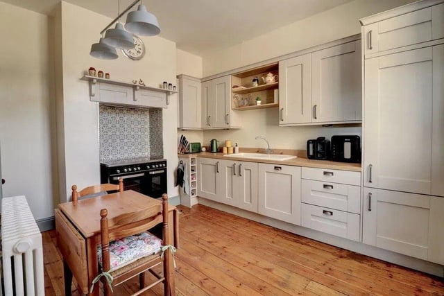 The kitchen is situated to the rear and offers dining space plus access to the useful basement cellar.