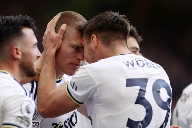 WOLVERHAMPTON, ENGLAND - MARCH 18: Rasmus Kristensen of Leeds United celebrates with Max Woeber and teammates after scoring the team's third goal during the Premier League match between Wolverhampton Wanderers and Leeds United at Molineux on March 18, 2023 in Wolverhampton, England. (Photo by Naomi Baker/Getty Images)