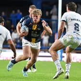 Leeds Rhinos' Zak Lloyd runs at the Toulouse Olympique defence during his debut last week. Picture by Matthew Merrick/SWpix.com.