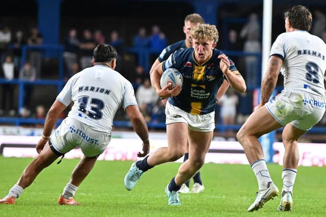 Leeds Rhinos' Zak Lloyd runs at the Toulouse Olympique defence during his debut last week. Picture by Matthew Merrick/SWpix.com.