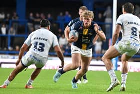 Leeds Rhinos' Zak Lloyd runs at the Toulouse Olympique defence during his debut last week. Picture by Matthew Merrick/SWpix.com.