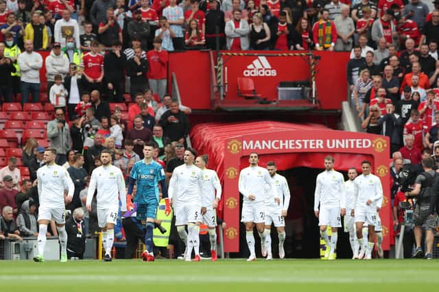 Liam Cooper of Leeds United leads his team out prior to the Premier League match between Manchester United and Leeds United at Old Trafford. (Photo by Alex Morton/Getty Images)