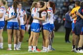 England duo Evie Cousins, right, of Leeds Rhinos and Wigan Warriors' Isabel Rowe console each other after the World Cup defeat by Samoa in Wollongong. Picture by David Neilson/SWpix.com.