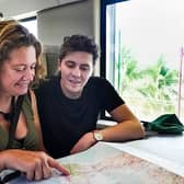 Dylan Llewellyn and mum Jackie study the map in Celebrity Race Across the World (Picture: :BBC/Studio Lambert)