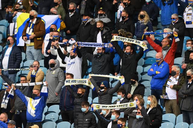 LEEDS, ENGLAND - MAY 23: Leeds fans support their team during the Premier League match between Leeds United and West Bromwich Albion at Elland Road on May 23, 2021 in Leeds, England. (Photo by Stu Forster/Getty Images)