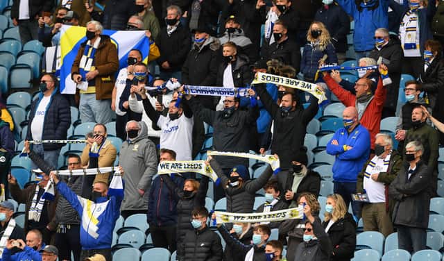 LEEDS, ENGLAND - MAY 23: Leeds fans support their team during the Premier League match between Leeds United and West Bromwich Albion at Elland Road on May 23, 2021 in Leeds, England. (Photo by Stu Forster/Getty Images)