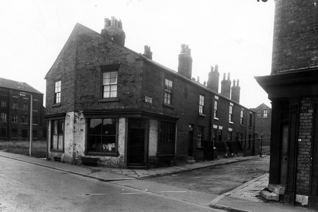 A small street of terraced housing on St Johns Place and the junction with Wortley Lane designated for Compulsory Purchase. Pictured in March 1965.