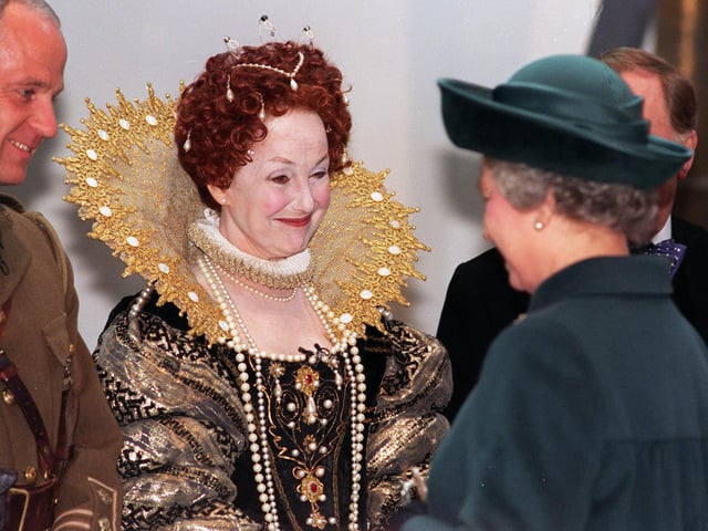 Actress Una Stubbs, in a costume of Queen Elizabeth I, meets Queen Elizabeth II during her visit to Leeds for the opening of the Royal Armouries museum in March 1996.