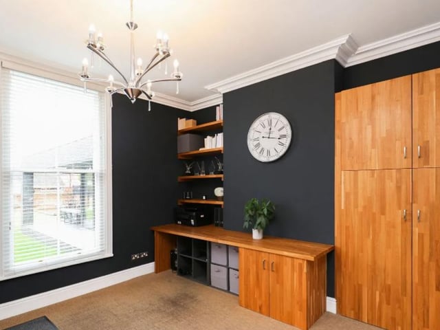 The office provides a comfortable work space, but it could also be converted into a bedroom.