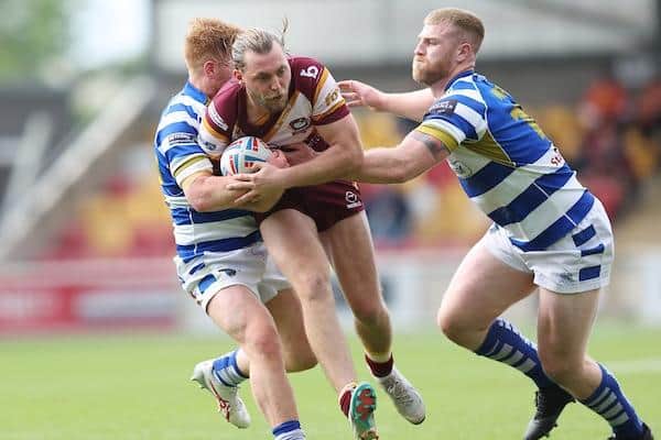 Batley Bulldogs' James Meadows tangles with Halifax Panthers' Thomas Inman at the Championship Summer Bash. Picture by John Clifton/SWpix.com.