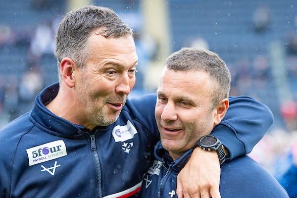 Rhinos legend Danny McGuire, now Hull KR's assistant-coach, celebrates with team boss Willie Peters.