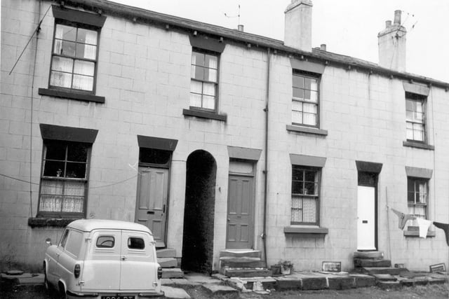 Back Green in 1961. A washing line extends from the house on the right. A white van registration 1004 DT is parked outside no 28. View looks north. Terrace is back-to-back with no 30-34 set behind no 12-16. A ginnel cuts through between two houses giving access to the homes behind.
