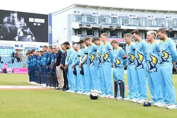 Players stand for a minute's silence for Rob Burrow before Yorkshire Vikings' Vitality Blast match against Derbyshire Falcons at Headingley. Picture by John Clifton/SWpix.com.