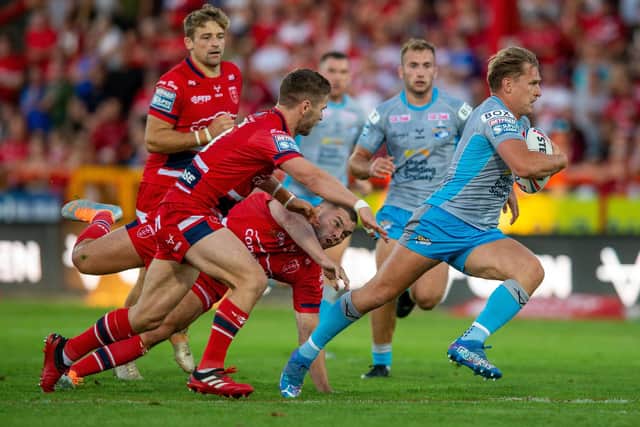 Brad Dwyer breaks away to score Leeds' first try at Hull KR. Picture by Bruce Rollinson.