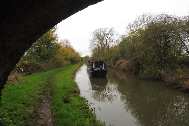 Sailing along the canal with peaceful surroundings.