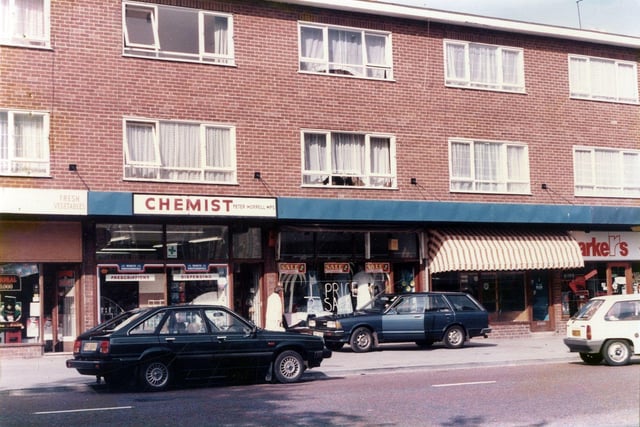 Part of a parade of shops on Upper Town Street in Bramley. They include Peter Morrell, chemist.